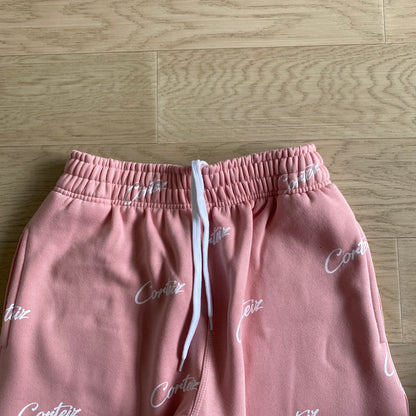 Corteiz All Over Print Joggers – Pink/White